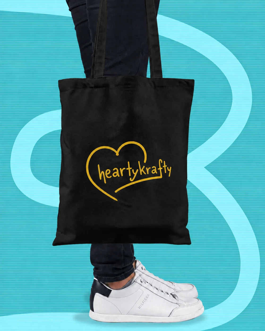 A branded canvas tote bag carried by hand