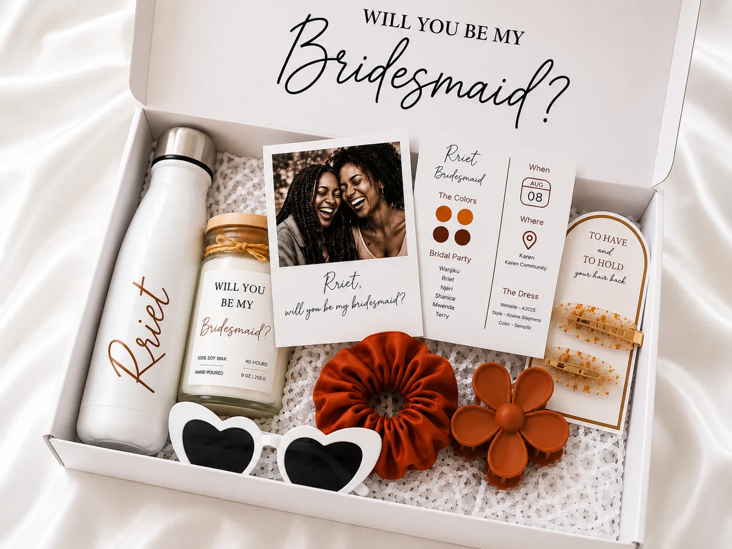 A bridesmaid proposal gift box holding a personalised bottle, a photo card, a keychain and a scrunchie